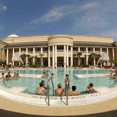 Students relaxing in the outdoor pool at Strom.