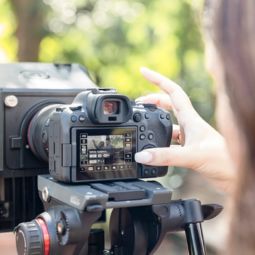 Person adjusting settings on a camera