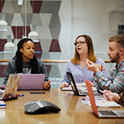 Students discussing something at a table