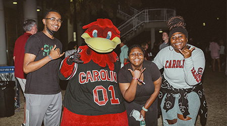 Family with Cocky at the Rock the Roost event.