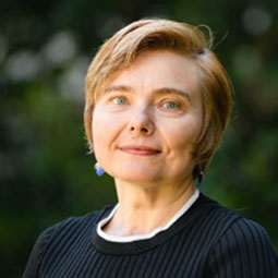 photo of a woman with dark blond hair and blue suit