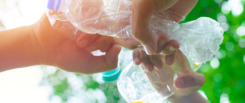 hands with plastics bottles