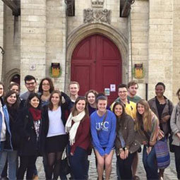 DLLC students smiling in front of a cathedral 