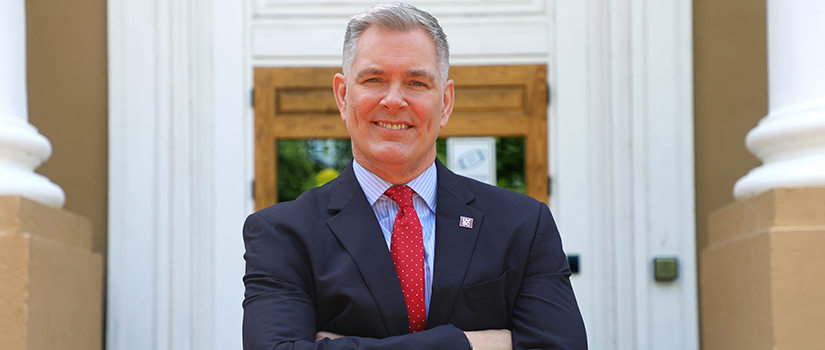 Tom Reichert in front of Davis College