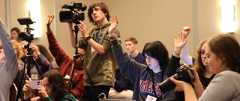students with video equipment and cameras
