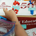 hands and USC banners