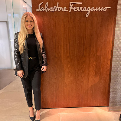 Samantha Gallagher stands by the Salvatore Ferragamo logo