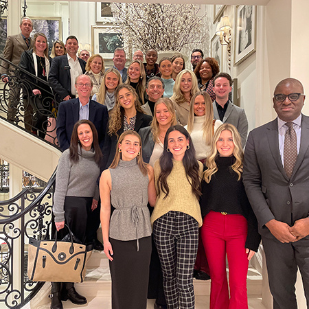 Students in the National Retail Federation student chapter pose for a photo with HRSM staff and faculty at the NRF Big Show in New York City.