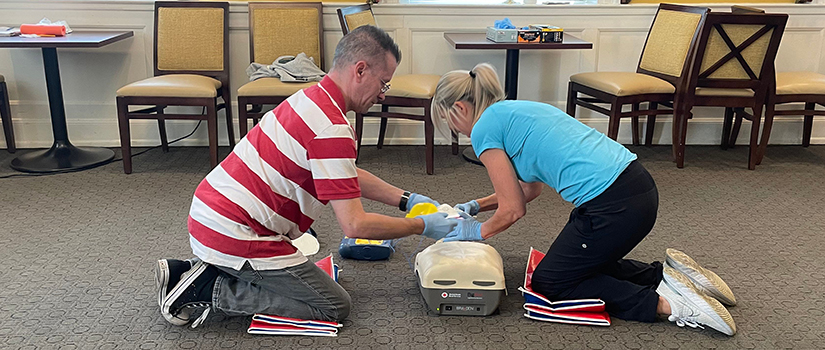 An HRSM employee receives instructions on CPR.