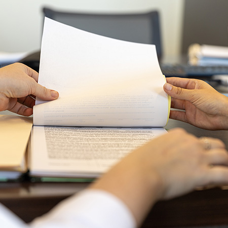 Hands holding paper