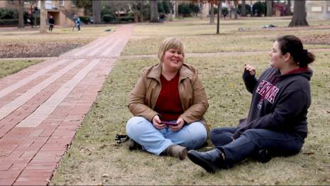 students sitting on Horseshoe grass