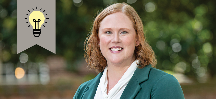 Associate professor of pharmacy Patricia Fabel smiles as she's on campus