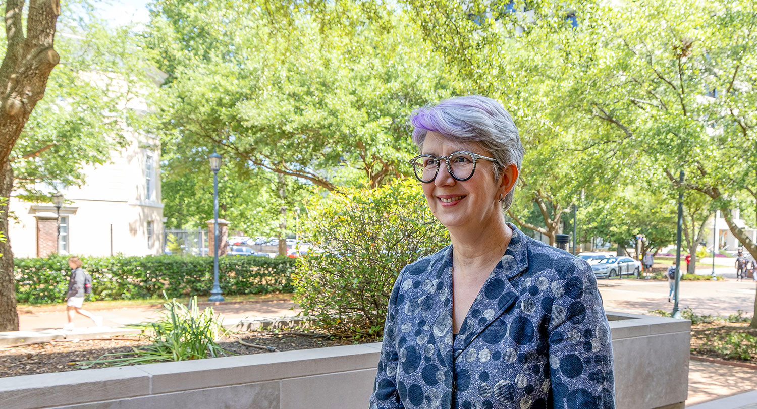 Carol Harrison smiles outside on USC's campus