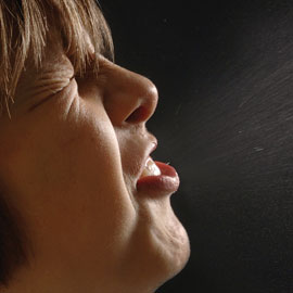 woman sneezing