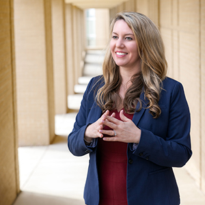 melissa nolan stands outside a building