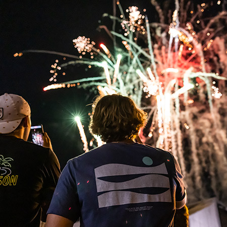 Two boys watching fireworks.