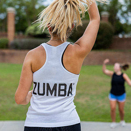 Woman teaching Zumba outside.