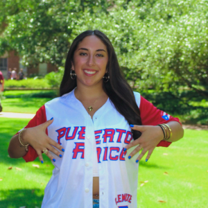 Raquel Negrón wearing a Puerto Rico baseball jersey.