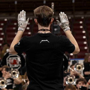 The drum major leads the Carolina bnad as it records the Metallica song for EA Sports.