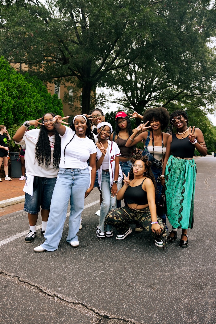 Group of students showing the peace sign