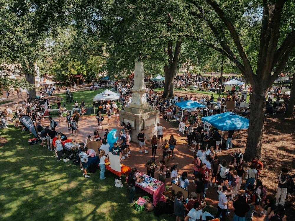 Aerial view of tents and students on the Horseshoe by Maxy Monument