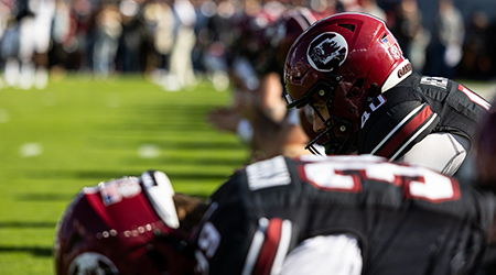 Two football players in position for a play.