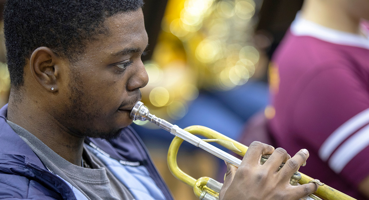 Music student playing a trumpet