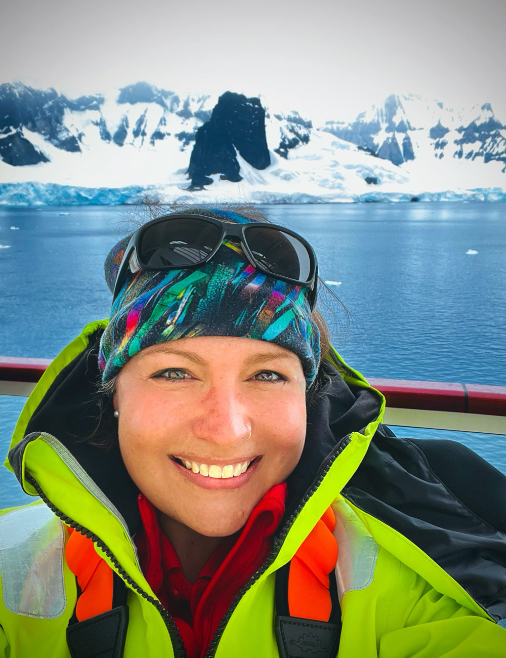 Brandi Revels with Antarctic mountains in the background.